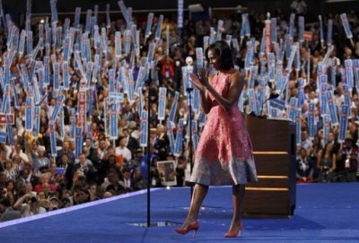 U.S. first lady Michelle Obama applauds after concluding her address to delegates during the first session of the Democratic National Convention in Charlotte, North Carolina, September 4, 2012.
