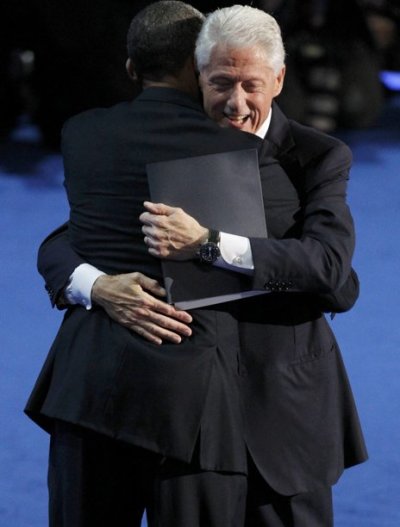 Former U.S. President Bill Clinton (R) hugs U.S. President Barack Obama after he nominated Obama for re-election during the second session of the Democratic National Convention in Charlotte, North Carolina, September 5, 2012.