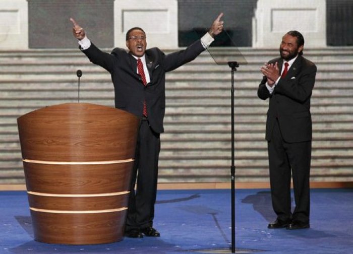U.S. Rep. Emanuel Cleaver II, (D-MO), Chairman of the Congressional Black Caucus, is applauded by U.S. Rep Al Green (D-TX) at right as he concludes his speech during the second session of the Democratic National Convention in Charlotte, N.C., Sept. 5, 2012.
