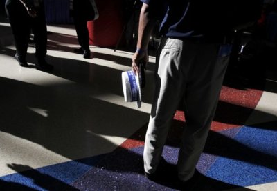 Delegates cast long shadows on the concourse during the Democratic National Convention in Charlotte, North Carolina, September 5, 2012.