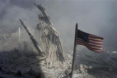 An American flag flies near the base of the destroyed World Trade Center in New York, in this file photo from Sept. 11, 2001, taken after the collapse of the towers.