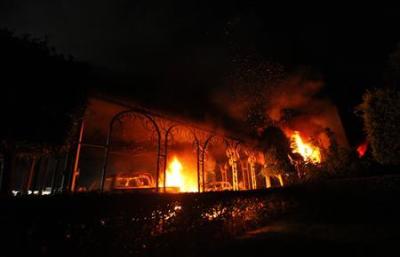The U.S. Consulate in Benghazi is seen in flames during a protest by an armed group said to have been protesting a film being produced in the United States September 11, 2012.