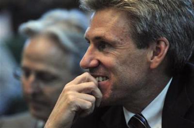 U.S. envoy Chris Stevens listens during a news conference held by leaders of Libya's rebel leadership after talks with representatives of the African Union in Benghazi April 11, 2011.