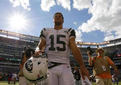 Tim Tebow leaves field after Jets 48-28 victory over the Buffalo Bills led by quarterback Mark Sanchez, Sept. 9, 2012.