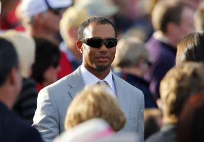 U.S. golfer Tiger Woods leaves at the end of the opening ceremony for the 39th Ryder Cup golf matches at the Medinah Country Club in Medinah, Illinois September 27, 2012.