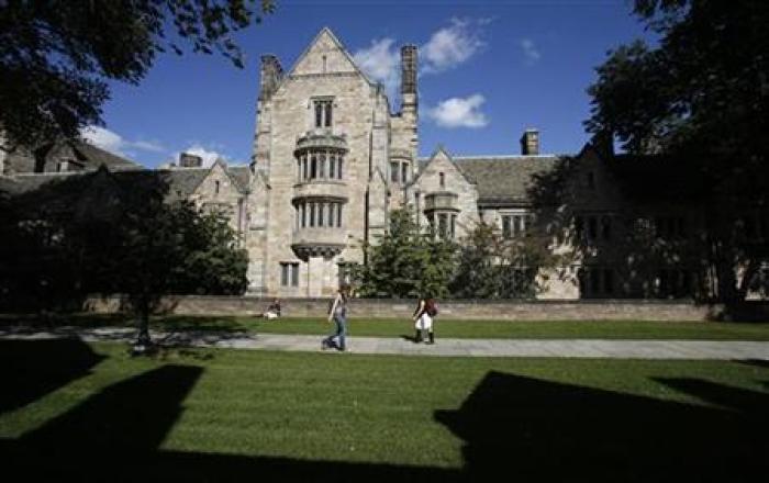 Students walk on the campus of Yale University in New Haven, Connecticut on Oct. 7, 2009.