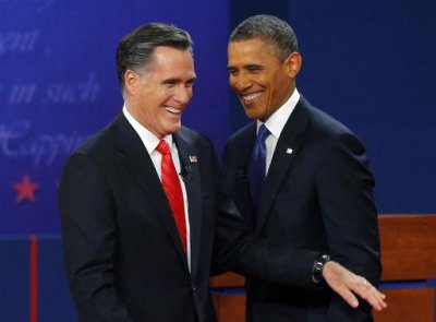 Republican presidential nominee and former Massachusetts Governor Mitt Romney (L) and U.S. President Barack Obama smile at the end of their first 2012 U.S. presidential debate in Denver October 3, 2012.