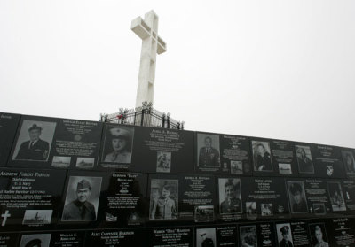 The Mount Soledad cross stands over memorials from the National War Memorial in Ja Jolla, California May 11, 2006.