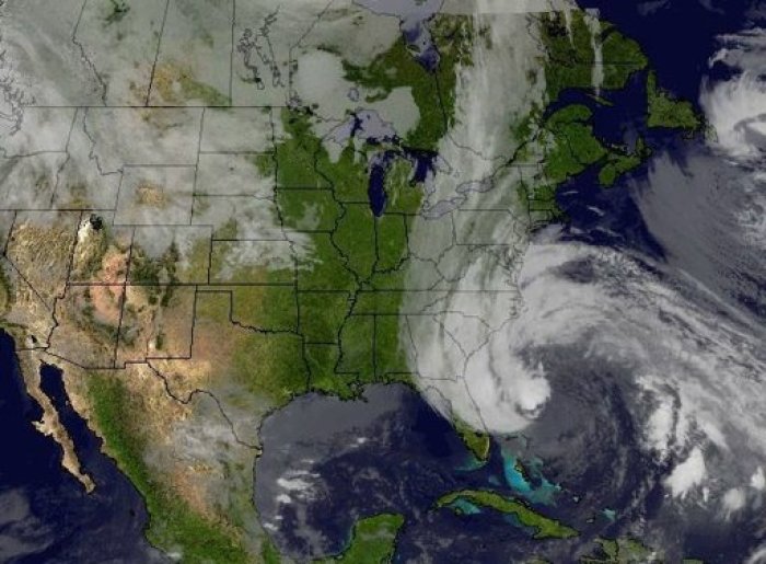 The cloud cover from Hurricane Sandy interacting with the long line of clouds associated with the cold front approaching the eastern U.S., is pictured in this image that was created combining NOAA's GOES-13 and GOES-15 satellite imagery, taken on October 27, 2012. Hurricane Sandy could be the biggest storm to hit the United States mainland when it comes ashore on Monday night, bringing strong winds and dangerous flooding to the East Coast from the mid-Atlantic states to New England, forecasters said on Sunday. Image taken October 27, 2012.