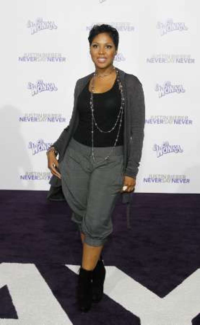 Singer Toni Braxton poses at the premiere of the documentary "Justin Bieber: Never Say Never" at Nokia theatre in Los Angeles February 8, 2011. The documentary opens in the U.S. on February 11.