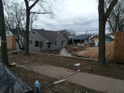 This image displays a house that was knocked off its foundation during Hurricane Sandy and now appears to be sinking. This picture was taken in the New Dorp Beach area of Staten Island.