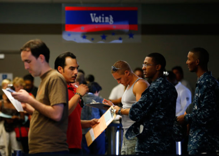People wait in line at the San Diego County of Registrar Voters as they register last minute to vote during the U.S. presidential election in San Diego, California, November 6, 2012.
