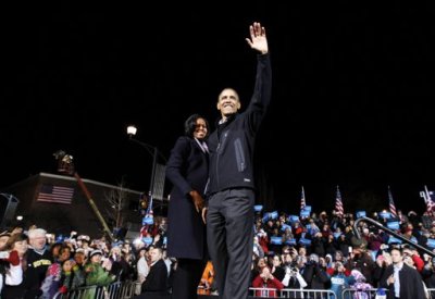 U.S. President Barack Obama waves to supporters as he stands next to first lady Michelle Obama during his final presidential campaign rally in Des Moines, Iowa, November 5, 2012.