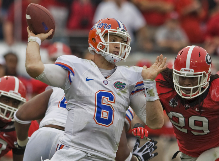 Florida quarterback Jeff Driskel (6) passes under pressure from Georgia's Jarvis Jones (29) during the second quarter of their NCAA college football game in Jacksonville, Florida, October 27, 2012.