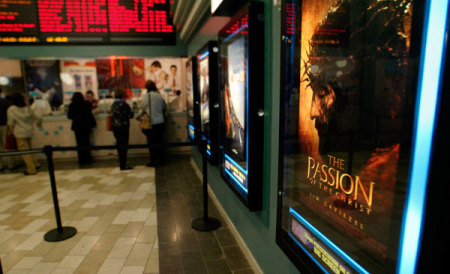 Patrons stand in line for tickets for a morning showing of "The Passion of the Christ," at Regal Cinemas in Buford, Georgia, February 25, 2004. The theatre had four screenings available per show as the movie officially opened to the public after several early church openings.