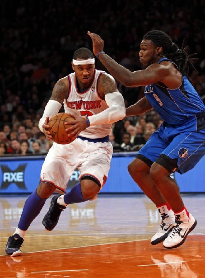 New York Knicks forward Carmelo Anthony drives to the basket defended by Dallas Mavericks forward Jae Crowder in the third quarter of their NBA basketball game at Madison Square Garden in New York,November 9, 2012.