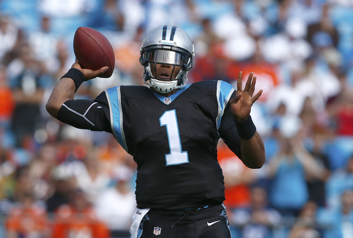 Carolina Panthers quarterback Cam Newton (1) throws a pass against the Denver Broncos during an NFL football game in Charlotte, North Carolina November 11, 2012.