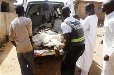 Security officials evacuate victims of a bomb attack at St. Rita's Catholic church in the Malali village in Nigeria's northern city of Kaduna Oct. 28, 2012. A suicide bomber drove a vehicle packed with explosives into a Catholic church in northern Nigeria, killing at least three people and triggering reprisal attacks that killed at least two more, witnesses and police said.