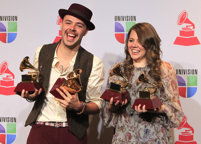 Jesse & Joy pose backstage with their four awards during the 13th Latin Grammy Awards in Las Vegas, Nevada, November 15, 2012.