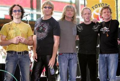 British rock band Def Leppard pose for a photo after their performance live on NBC's 'Today' show in New York on May 27, 2005. 