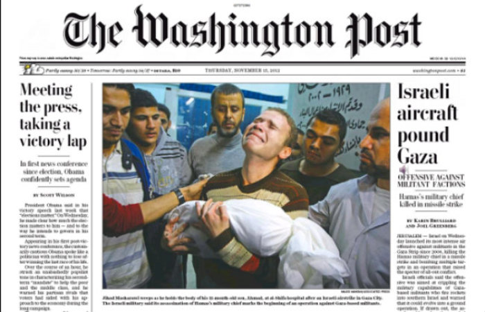 Jihad Misharawi, a BBC Arabic journalist who lives in Gaza, carries the body of his 11-month old son, Omar, through al-Shifa hospital in Gaza City, in this Nov. 15, 2012 front page photo from The Washington Post.