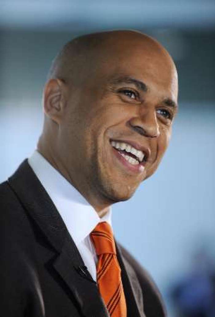 Cory Booker, Mayor of Newark, New Jersey, smiles during an interview at the Newseum in Washington October 2, 2009. The interview was part of the First Draft of History event, held by the Atlantic Magazine and the Aspen Institute to bring together newsmakers, historians and journalists.