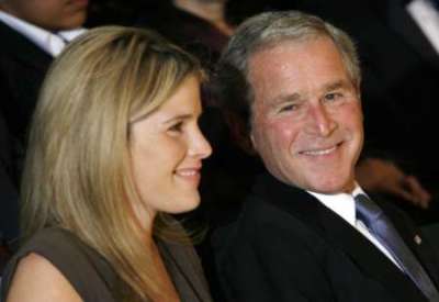 U.S. President George W. Bush and his daughter Jenna smile as they attend the 2008 National Book Festival Gala Performance at the Library of Congress in Washington September 26, 2008.