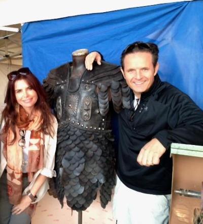 Married couple Roma Downey and Mark Burnett pose with a costume from the television series 'The Bible.'