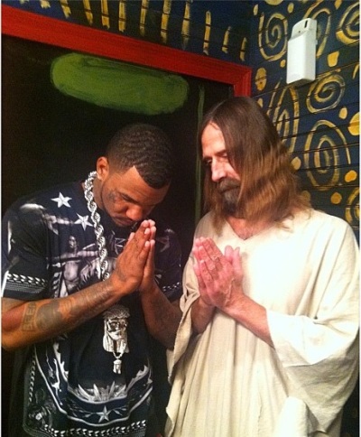 Rapper 'The Game' poses with the 'Hollywood Jesus,' a.k.a Kevin Lee Light, backstage at the album release party for 'Jesus Piece' on Dec. 11, 2012.