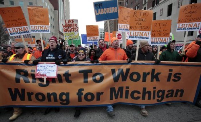 Union members and supporters march to the Michigan State Capitol building to protest against right-to-work legislation in Lansing, Michigan December 11, 2012.
