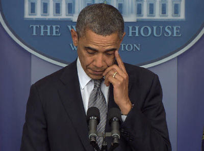 President Barack Obama wipes his eye during a press conference Friday, Dec. 14, 2012, while speaking on a shooting that killed at least two dozen people, mostly children, at Sandy Hook Elementary School in Newtown, Conn.