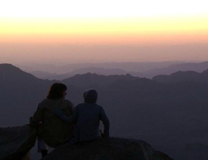 ABC News Global Affairs Anchor Christiane Amanpour and her son, Darius, watch the sun rise from Mount Sinai in 'Back to the Beginning'.