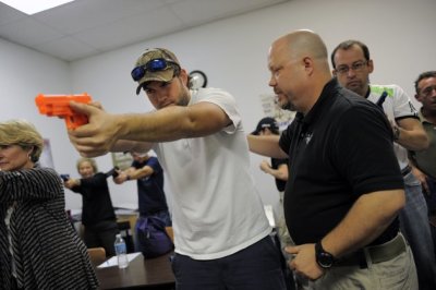 A concealed weapons permit class takes place at Take Aim Gun Range in Sarasota, Florida December 15, 2012.