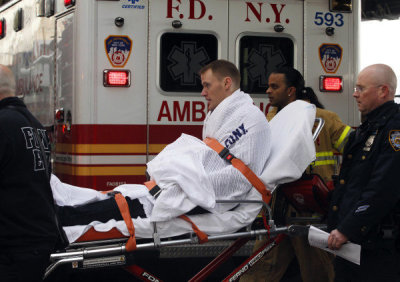 A passenger injured in a ferry crash aboard the Seastreak Wall Street Jan. 9, 2012, is transported on a stretcher in lower Manhattan in New York City.