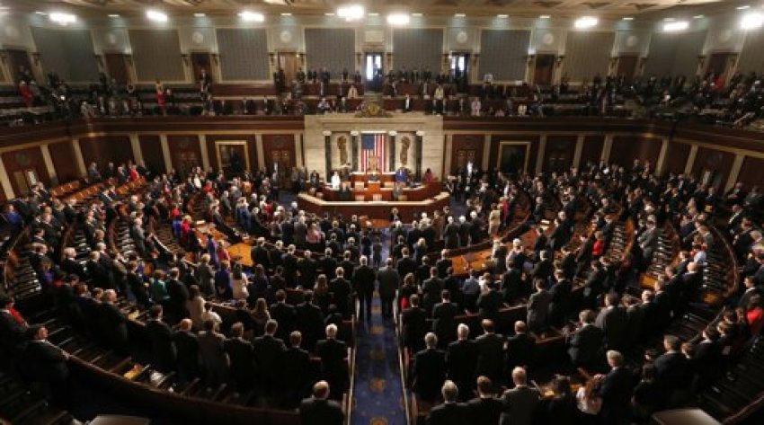 Members of the 113th Congress bow their heads in prayer as they convene in the Capitol in Washington January 3, 2013. In the wake of bruising fights in their own ranks over the "fiscal cliff" and aid for victims of superstorm Sandy - Republicans in the U.S. House of Representatives open a new Congress on Thursday more divided than ever.