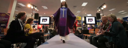 Clergy member Beth Allison models purple silk for Advent in a "Clergy Catwalk" fashion show at the Christian Resources Exhibition in Bristol, U.K., on Jan. 23, 2013.