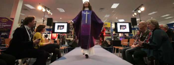 Clergy member Beth Allison models purple silk for Advent in a 'Clergy Catwalk' fashion show at the Christian Resources Exhibition in Bristol, U.K., on Jan. 23, 2013.