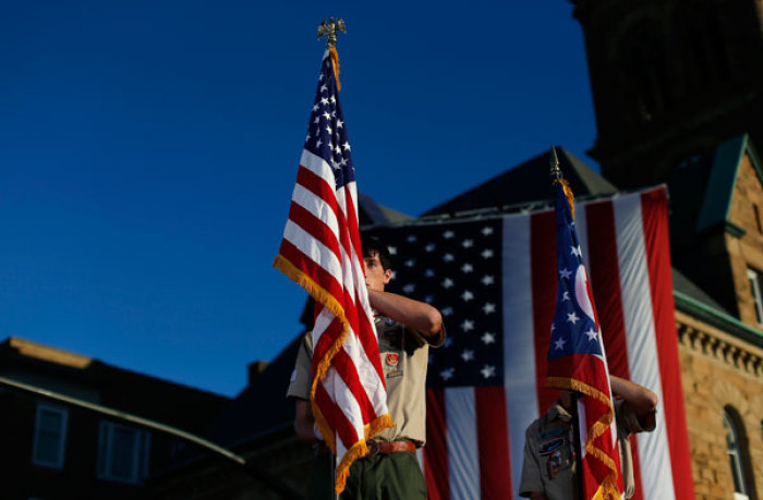 Boy Scouts stand at attention during the Pledge of Allegiance in Lancaster, Ohio October 12, 2012.