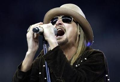 Singer and songwriter Kid Rock performs his new song and album title track ''Born Free'' during halftime of the Thanksgiving Day NFL football game between the Detroit Lions and the New England Patriots in Detroit, Michigan November 25, 2010.