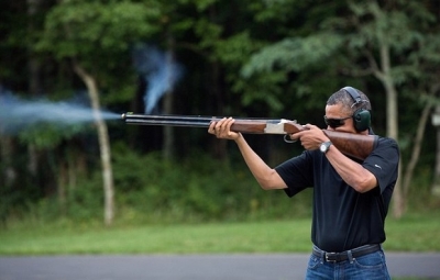 The White House has released this photo of President Barack Obama firing a gun.