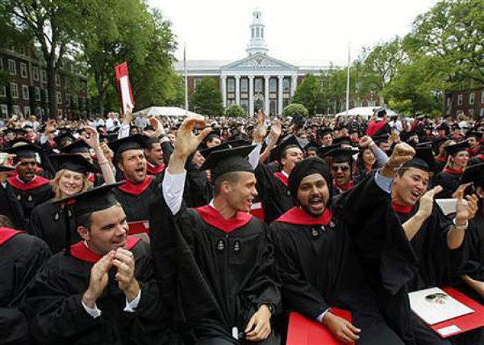 Harvard Business School students cheer during their graduation ceremonies in Boston, Massachusetts following Harvard University's 358th Commencement June 4, 2009.