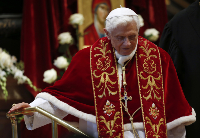 Pope Benedict XVI leaves at the end of a mass at the St. Peter's Basilica in the Vatican February 9, 2013. Pope Benedict will step down as head of the Catholic Church on Feb. 28, the Vatican confirmed on February 11, 2013.