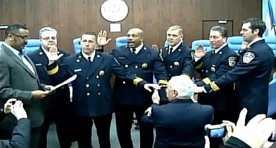 Firefighters swear-in using Apple's iPad Bible app in Atlantic City, New Jersey on Feb. 8.