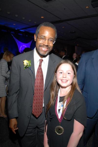 Dr. Benjamin Carson with a Carson Scholarship recipient,