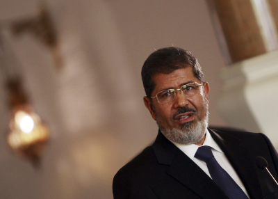 Egypt's new Islamist President Mohamed Morsi speaks during a news conference at the presidential palace in Cairo July 13, 2012.