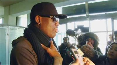 Former U.S. NBA basketball player Dennis Rodman speaks to the media at the airport before departing Pyongyang, March 1, 2013 in this still image taken from video. Rodman watched a basketball match with North Korean leader Kim Jong-un and his wife Ri Sol-ju in Pyongyang on Thursday, North Korea state media reported.