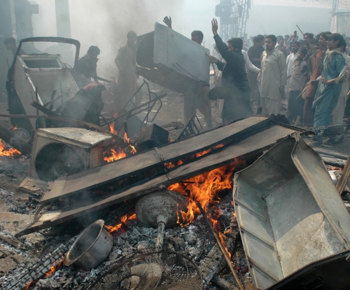 Muslim mobs attack a Christian area of Lahore after blasphemy allegations.