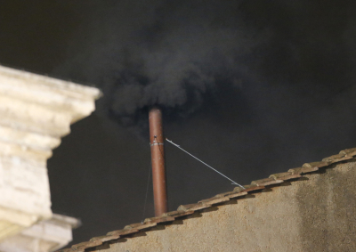 Black smoke rises from the chimney on the roof of the Sistine Chapel in the Vatican City indicating that no decision has been made after the first day of voting for the election of a new pope, March 12, 2013. Roman Catholic Cardinals started a conclave on Tuesday to elect a successor to Pope Benedict, who abdicated last month.