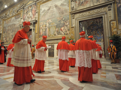 Cardinals enter the Sistine Chapel to begin the conclave in order to elect a successor to Pope Benedict March 12, 2013.