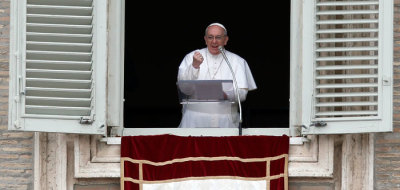 Newly elected Pope Francis appears at the window of his future private apartment to bless the faithful, gathered below in St. Peter's Square, during the Sunday Angelus prayer at the Vatican on March 17, 2013.